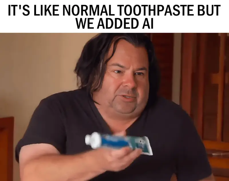 Funny AI meme showing a man holding toothpaste labeled as AI powered, mocking how everything now claims to have AI.